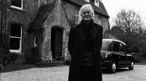 Jimmy Page of Led Zeppelin in front of Aleister Crowley's home in Scotland
