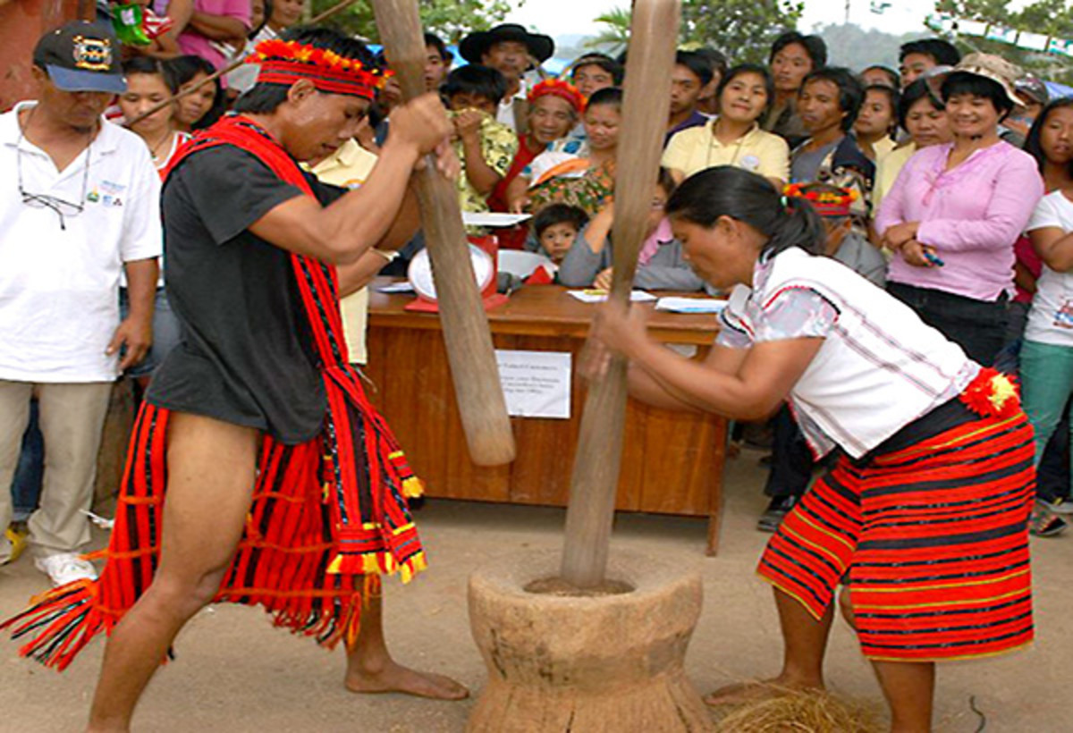 A giant mortar and pestle being used.